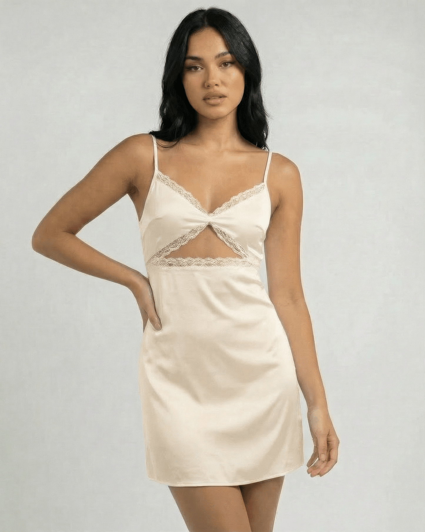 Ivorya Mini Dress by Lauven features delicate lace trim and slender spaghetti straps, exuding vintage elegance.