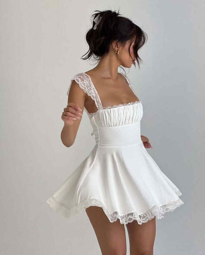 Elegant white lace mini dress for women, perfect for weddings or summer parties, featuring a flattering silhouette.
