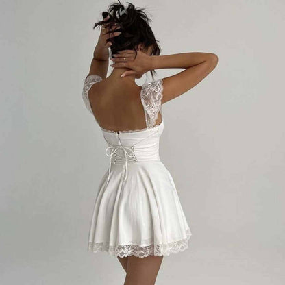 Elegant white lace mini dress showcasing a flared silhouette, perfect for summer parties or wedding guest outfits.