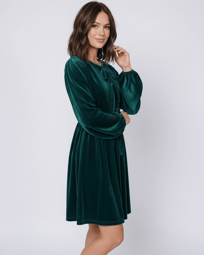 Jade Mini Dress by Lauven, featuring a plush emerald velvet fabric, lantern sleeves, and a feminine silhouette.