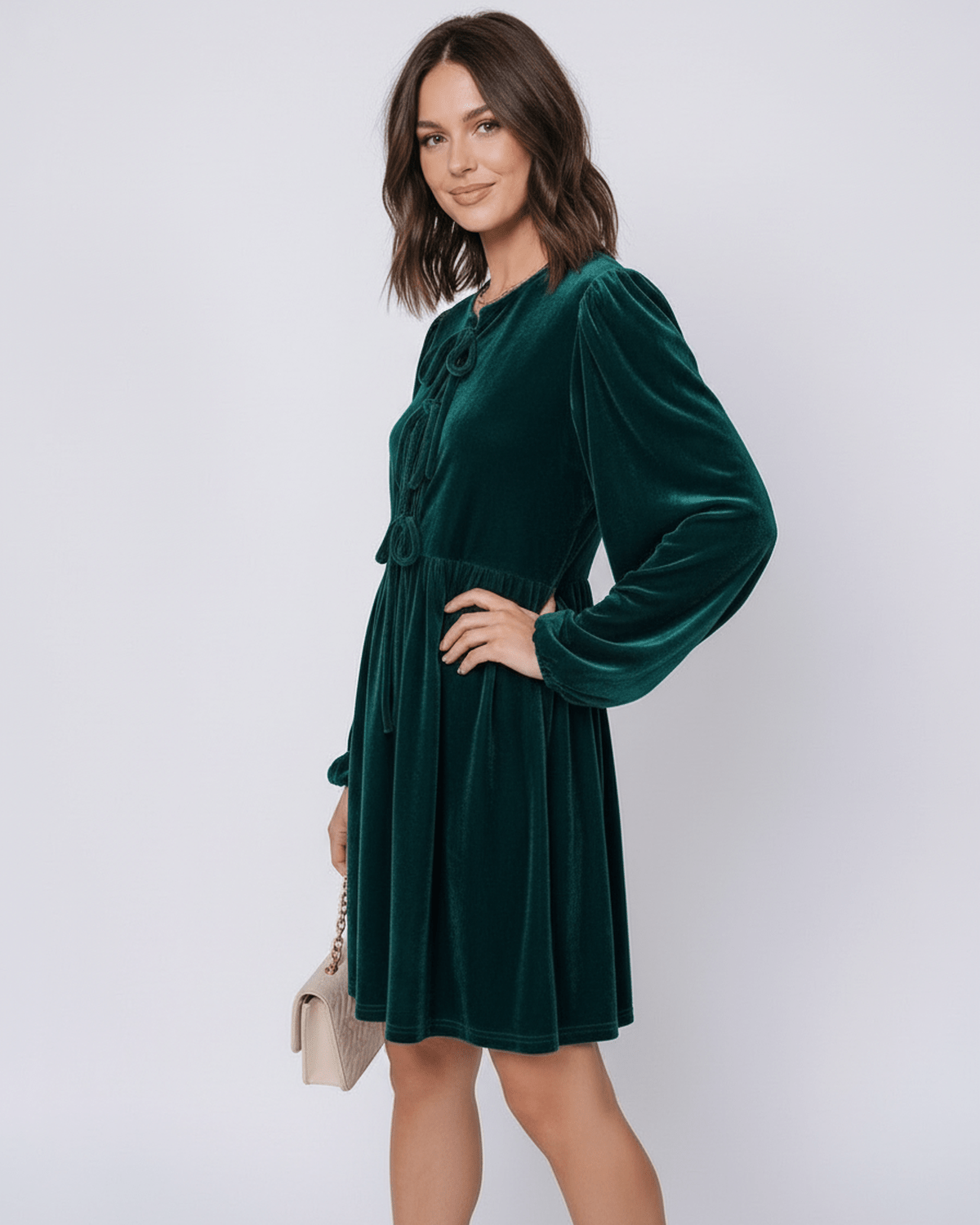 Model wearing Lauven Jade Mini Dress, a velvet dress with lantern sleeves and a relaxed waist, showcasing its elegant design.