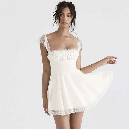 Model wearing a white lace mini dress featuring delicate ruffles and a flared silhouette, perfect for special occasions.