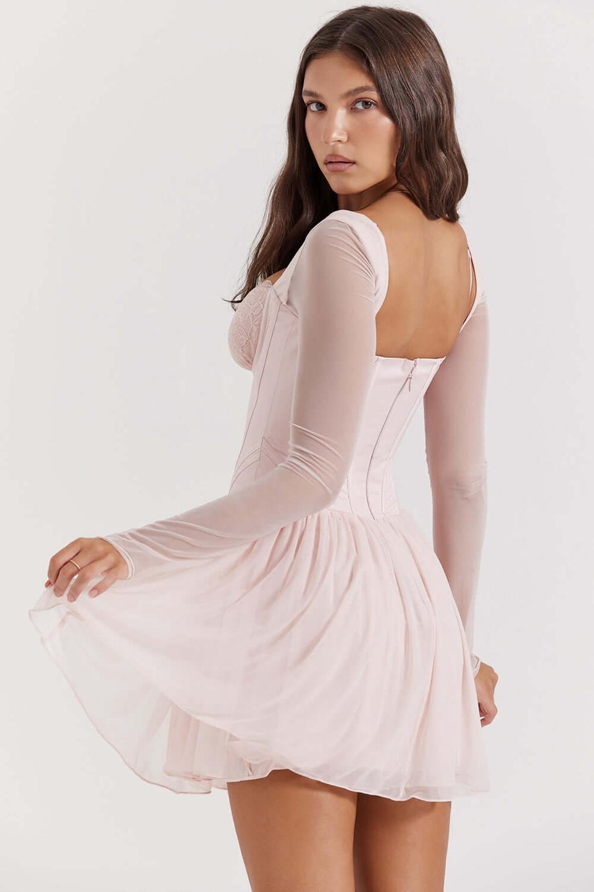 Kaia Mini Dress featuring a corset bodice and delicate mesh sleeves, perfect for summer weddings and cocktail parties.