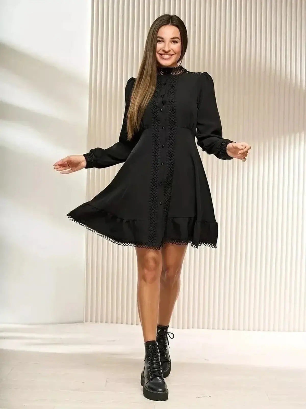 Black mini dress with lace trim and ruffled hem, perfect for summer parties and formal events.