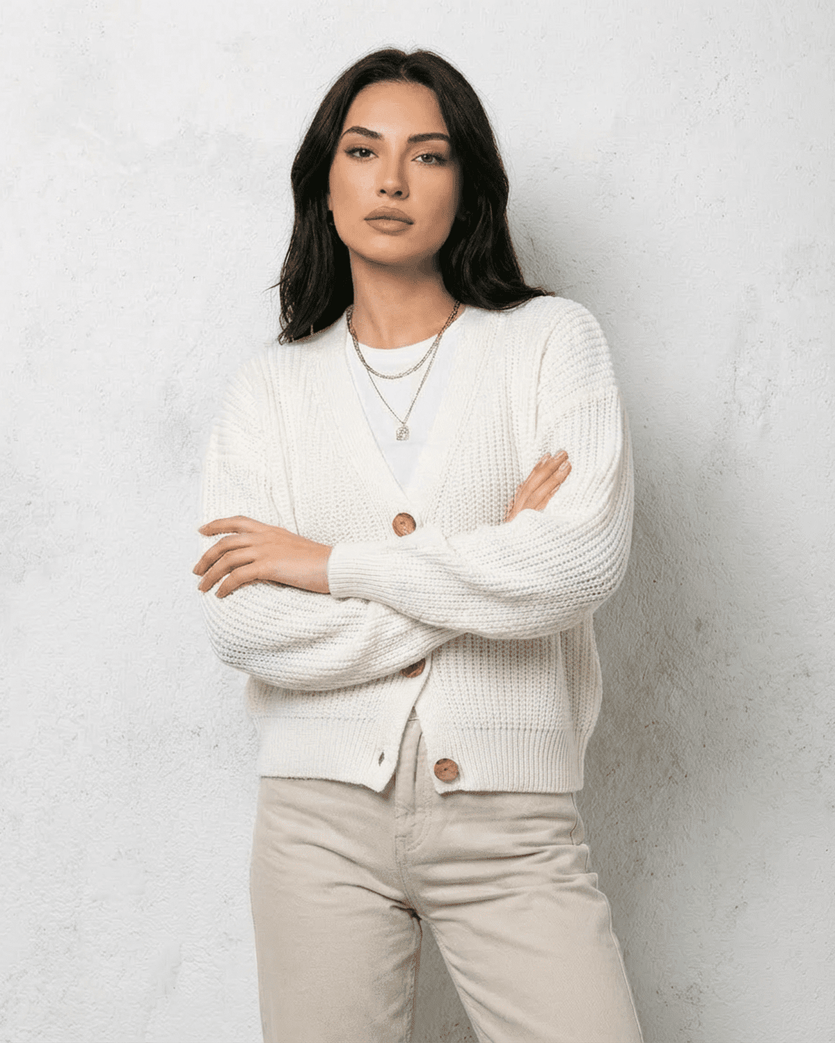 Alba Cardigan by Lauven, a classic white knitwear piece with soft V-neck, perfect for layering in cooler seasons.
