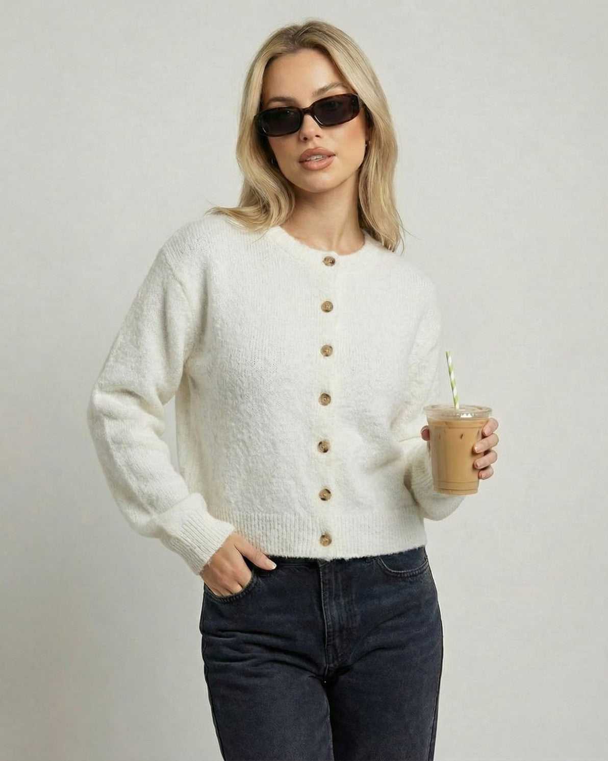 Alba Cardigan by Lauven, ivory button-front knit cardigan worn with sunglasses and iced coffee.