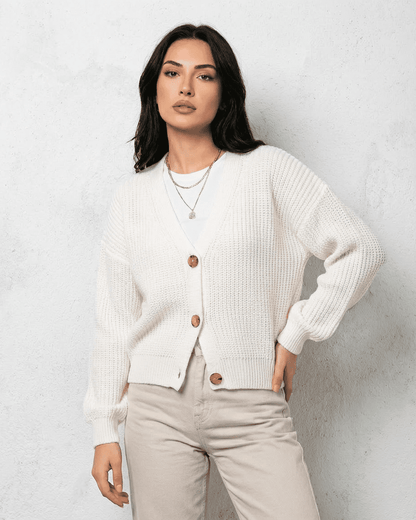 Alba Cardigan by Lauven, featuring classic white knit with soft V-neck and button closure, ideal for layering in fall.