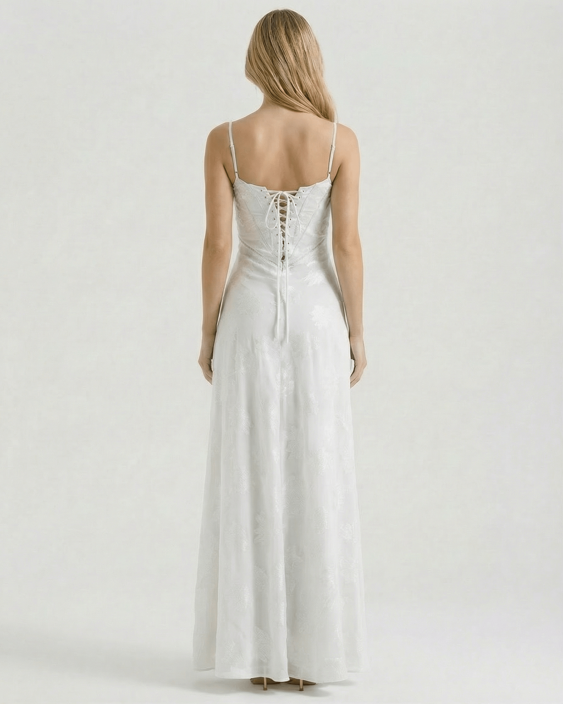 Albaea Maxi Dress by Lauven, showcasing the sheer lace-up back and elegant flowing design.