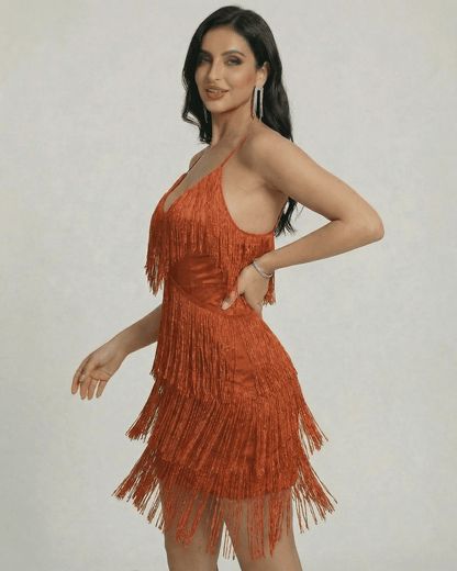 Lauven Amber Mini Dress featuring fringe detailing and a sleek V-neck silhouette in a warm amber tone.