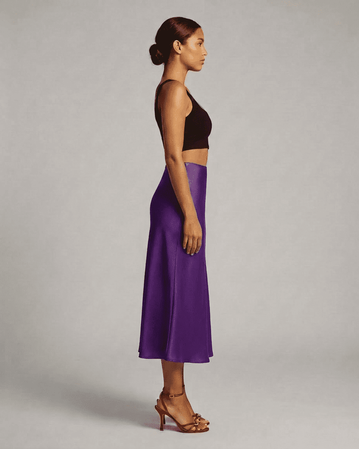 Amethyst Midi Skirt by Lauven showcased on a model, highlighting its elegant silhouette and rich purple color.