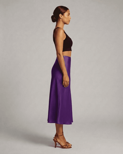 Amethyst Midi Skirt by Lauven showcased on a model, highlighting its elegant silhouette and rich purple color.