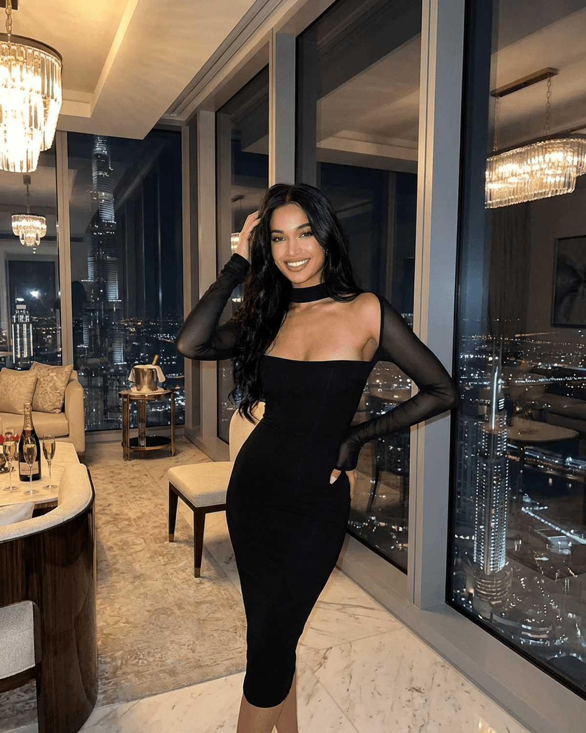 Arden Midi Dress by Lauven, featuring long sheer sleeves and a stylish cutout, set in an elegant cityscape.