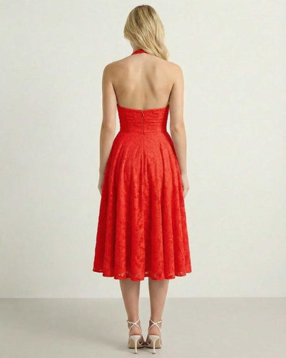 Aria Midi Dress by Lauven, showcasing the back view with a flattering A-line silhouette in bright red.