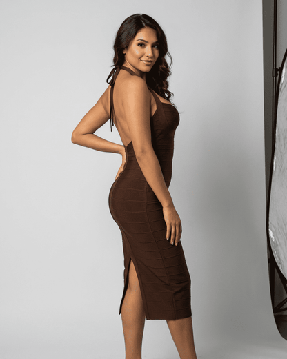 Model showcasing the Asteria Midi Dress by Lauven, featuring a sleek halter design and ribbed wide knit fabric.