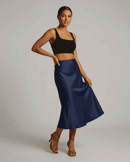 Astra Midi Skirt by Lauven, elegant satin mermaid midi skirt in deep navy blue, showcasing a sleek silhouette.