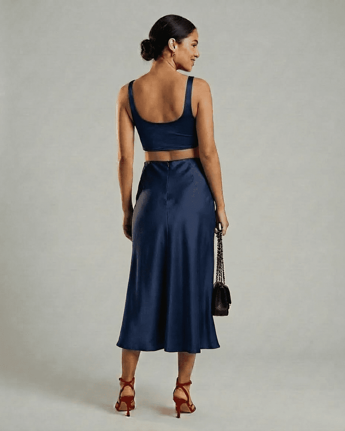 Astra Midi Skirt by Lauven - elegant satin mermaid midi skirt in deep navy blue, showcasing a sleek silhouette.
