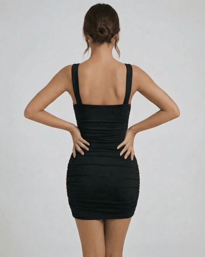 Astra Mini Dress by Lauven, showcasing a sleek black bodycon fit with a modern asymmetrical design.