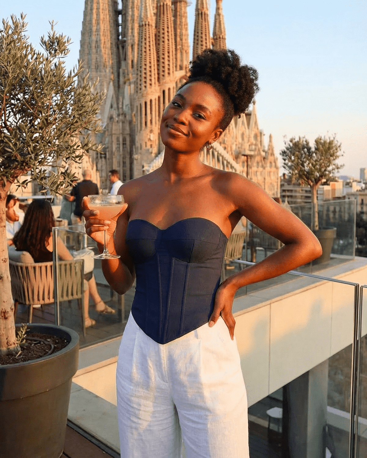 Model showcasing the Atlas Corset Top by Lauven, a faux denim bustier, against a stylish backdrop.