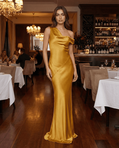 Aurelia Maxi Dress by Lauven, satin gold dress with high waist and open back, elegantly draping floor-length silhouette.