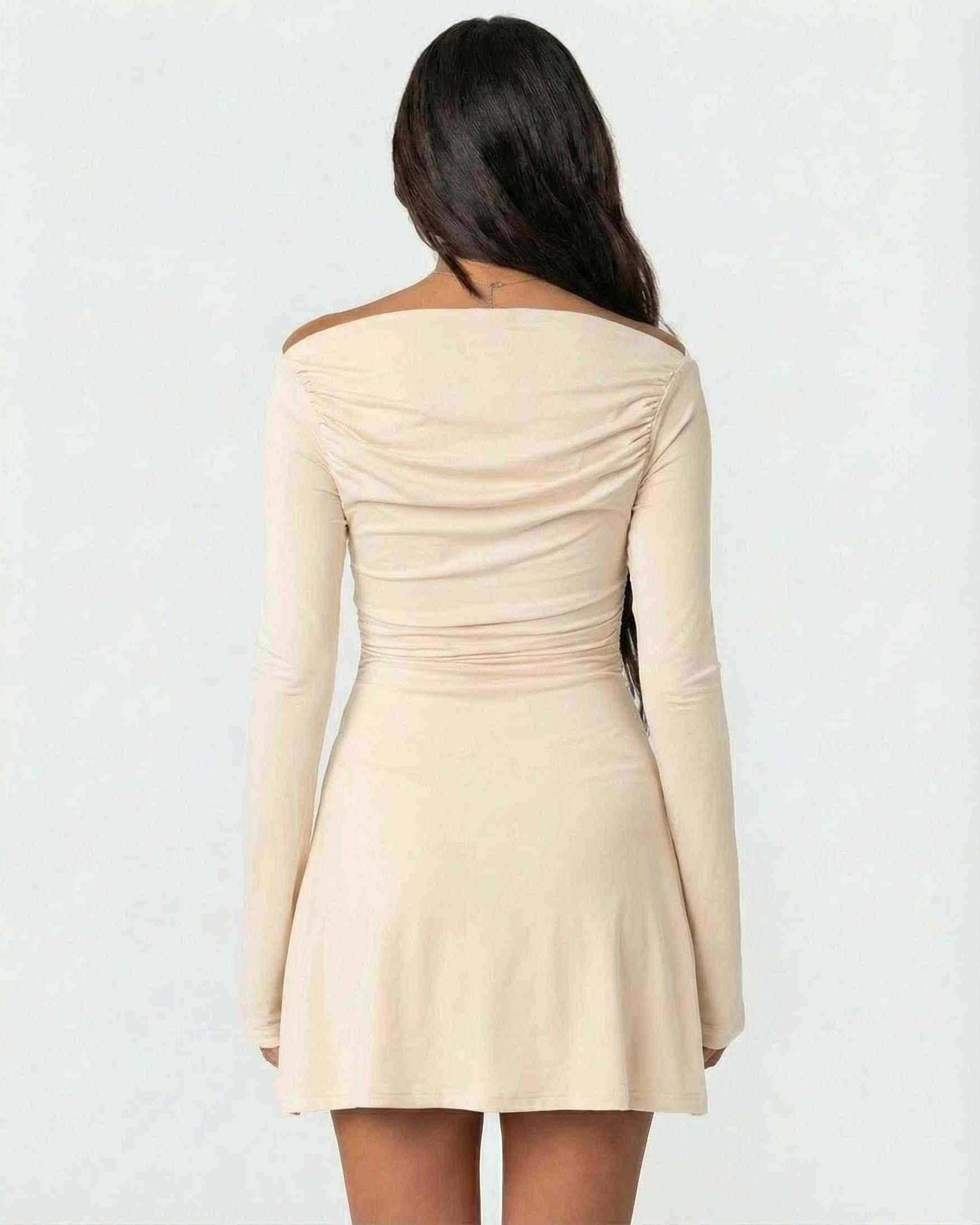 Aurelia Mini Dress by Lauven, showcasing the back view of a cream bodycon mini dress with asymmetrical neckline and long sleeves.