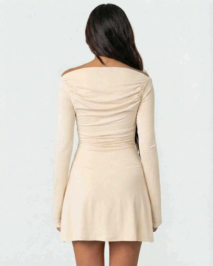 Aurelia Mini Dress by Lauven, showcasing the back view of a cream bodycon mini dress with asymmetrical neckline and long sleeves.