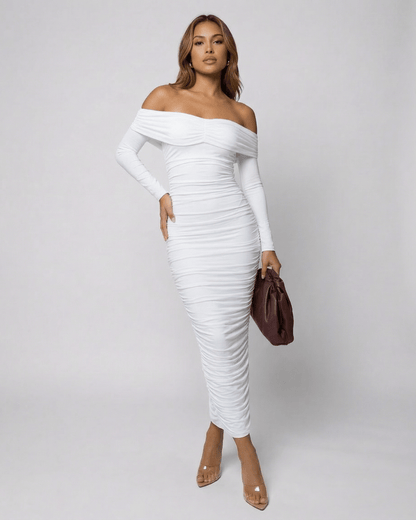 Model showcasing the Auriel Midi Dress by Lauven, an off-the-shoulder, ruched white midi dress.