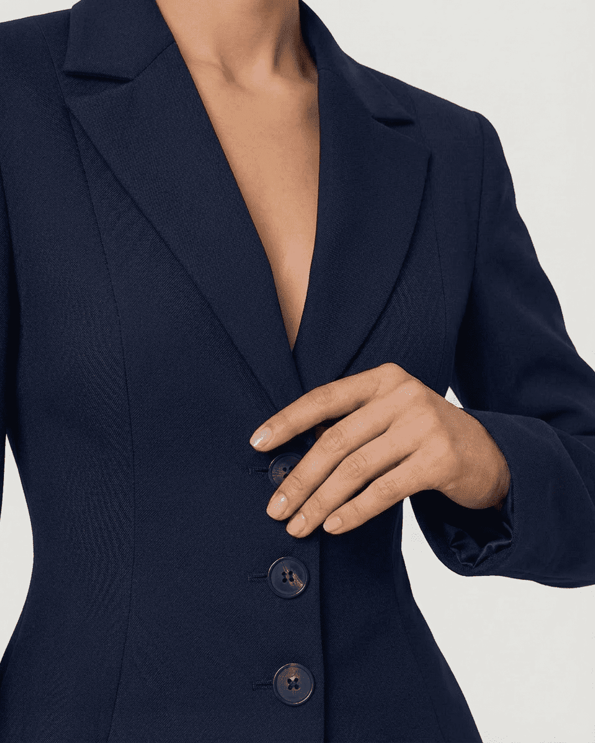 Aurora Blazer by Lauven, showcasing a fitted waist, V-neckline, and stylish button detail in navy.