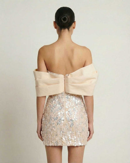 Aurora Mini Dress by Lauven – Champagne sequin strapless party dress with draped chest wrap.