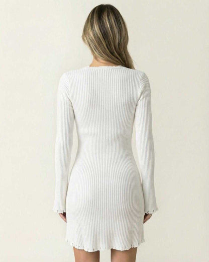 Aurora Mini Dress by Lauven - Back view showcasing the elegant ribbed design and flare sleeves in white.