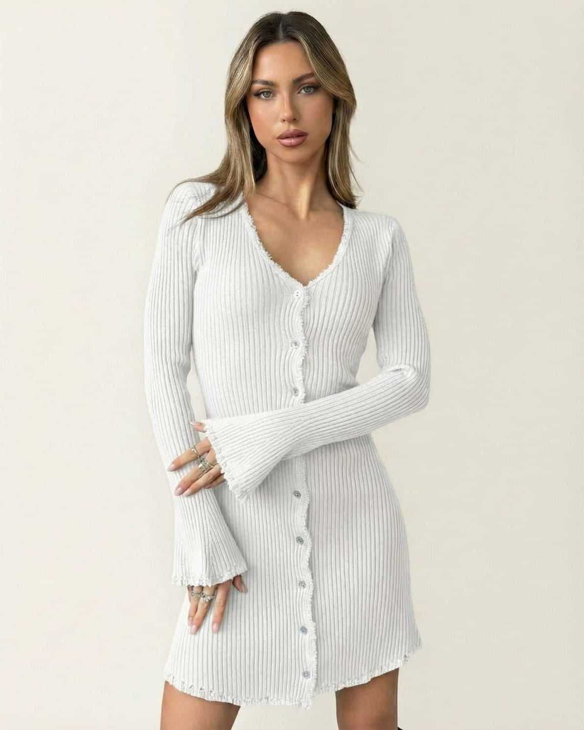 Aurora Mini Dress by Lauven, a refined ribbed bodycon mini dress in white with flare sleeves and button-front closures.