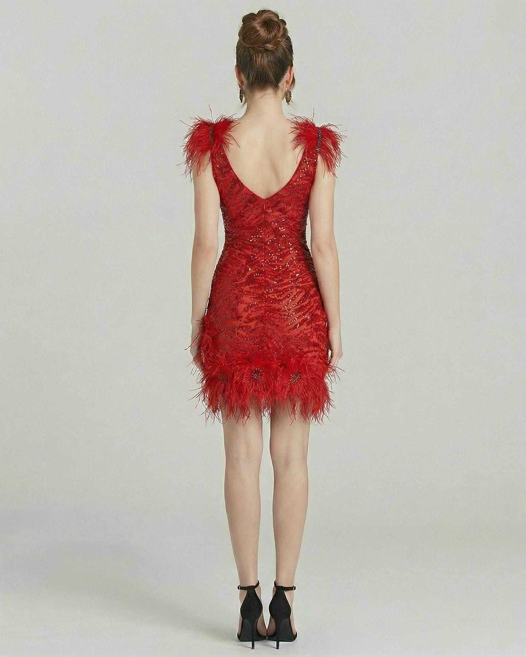 Aurora Mini Dress by Lauven featuring feathered accents and sequin embellishments in vibrant red.