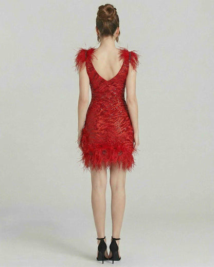 Aurora Mini Dress by Lauven featuring feathered accents and sequin embellishments in vibrant red.