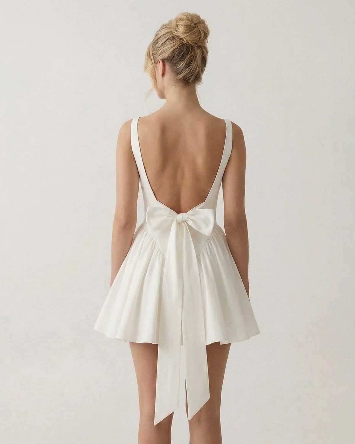 Aurora Mini Dress by Lauven featuring a square neck backless design and bow detail on the back.