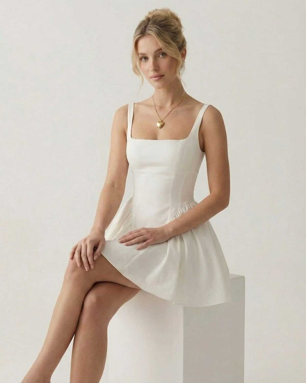 Aurora Mini Dress by Lauven - Stylish square neck backless mini dress with bow detail and A-line shape.