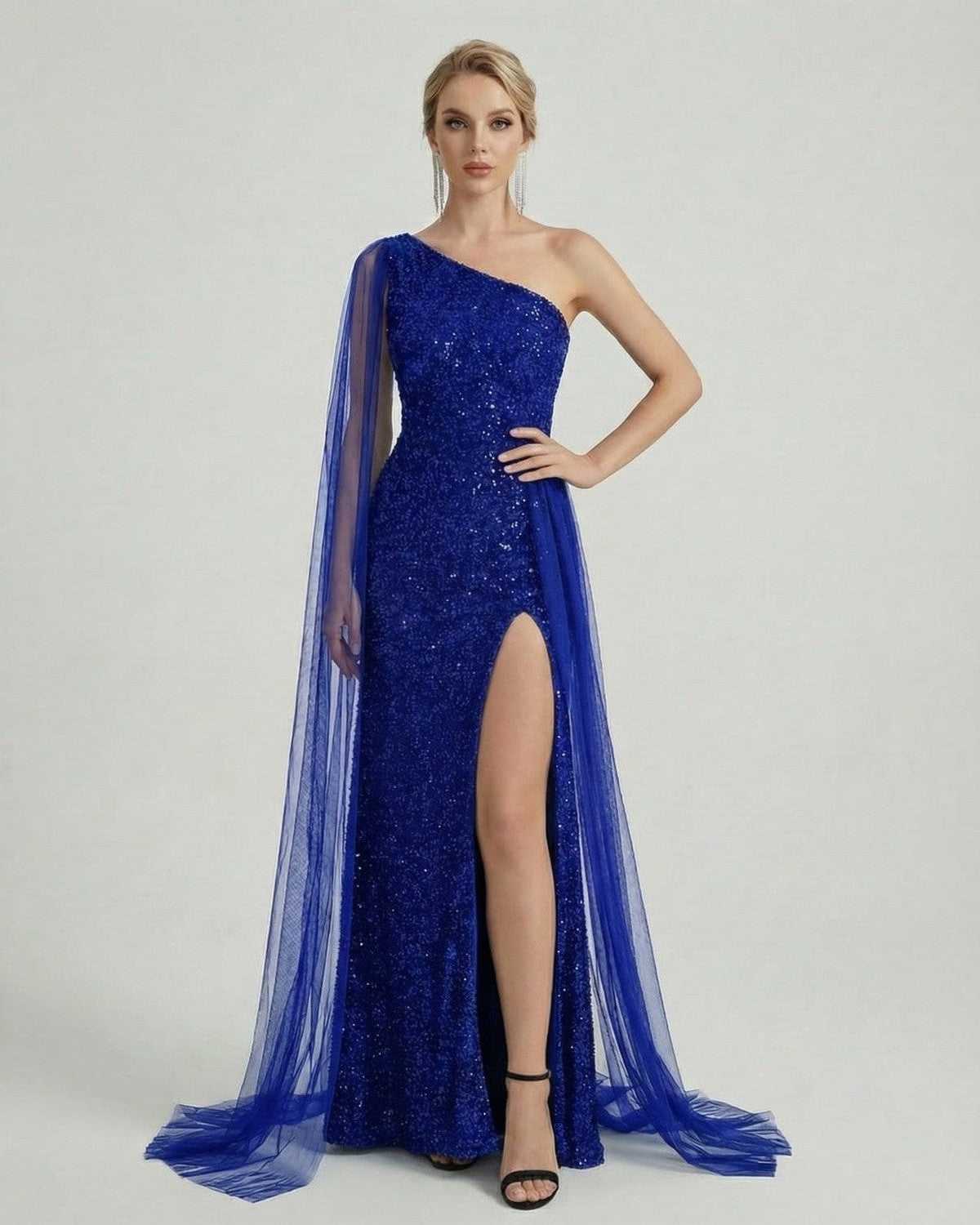 Model wearing Azure Maxi Dress by Lauven, featuring one shoulder design, sequins, and sheer mesh drape.