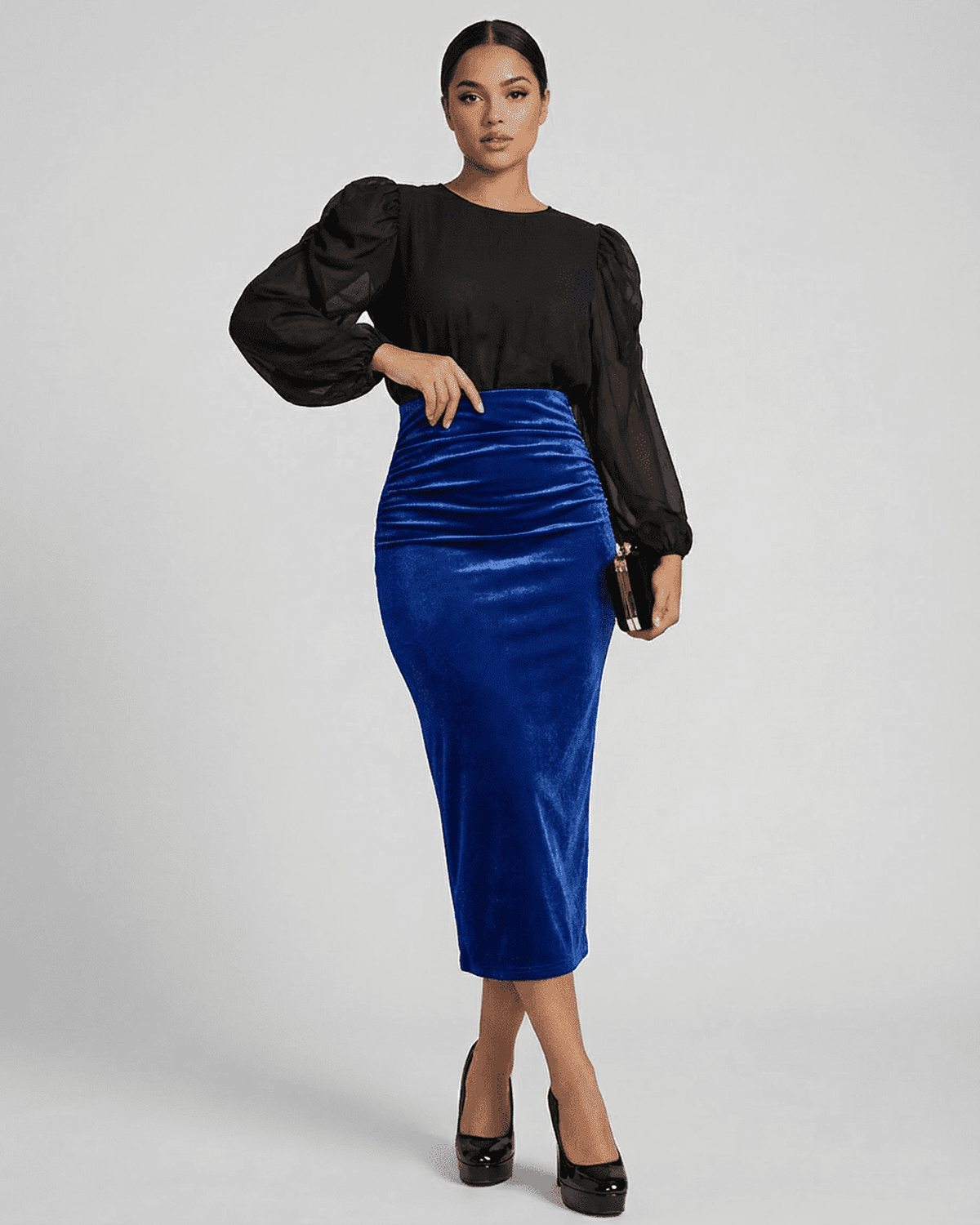 Model wearing Azure Midi Skirt by Lauven, a high-waisted velvet pencil skirt in deep blue with elegant back slit.