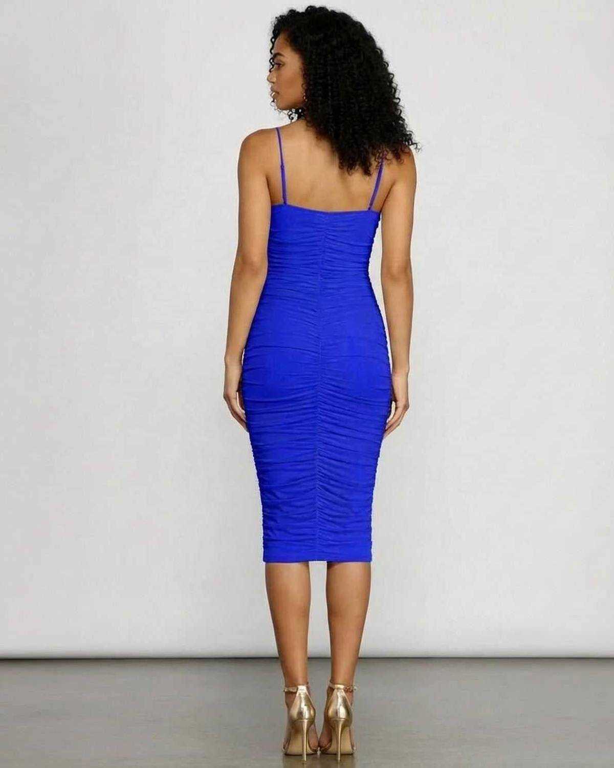 Back view of a woman wearing the Azurielle Midi Dress by Lauven, showcasing its ruched bodycon silhouette.