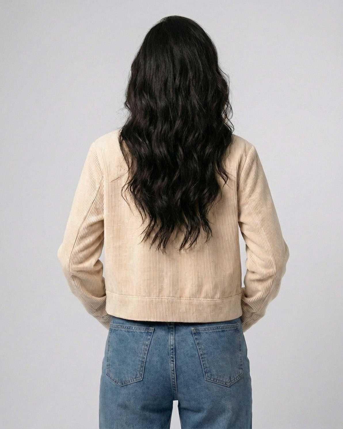 Back view of a woman wearing a Lauven Beige Slim Jacket, showcasing its fitted design and stylish silhouette.