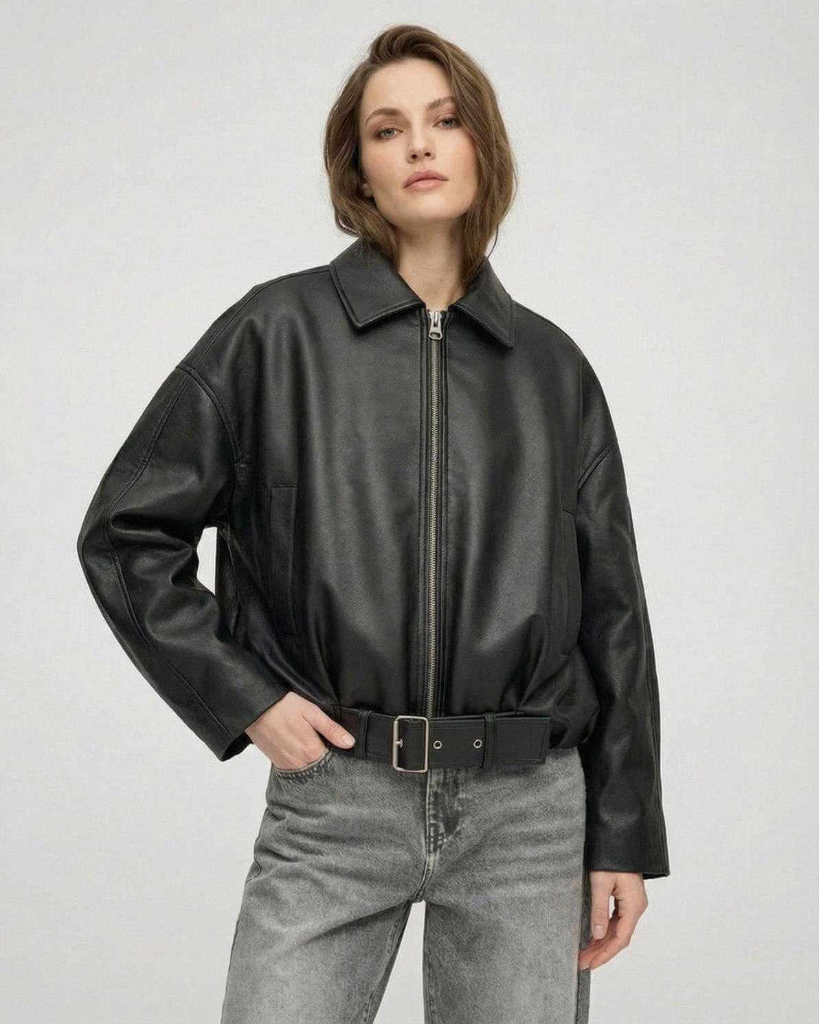 Black Belted Jacket by Lauven, featuring an oversized fit and structured collar, showcasing a sleek leather-look finish.