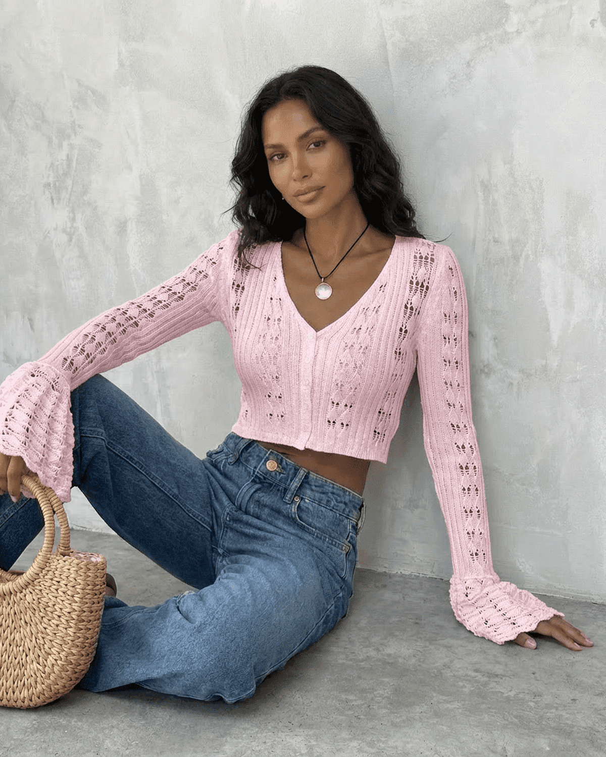 Lauven Blossom Cardigan in pink, a cropped cotton knit with flare sleeves and V-neckline, styled with denim.
