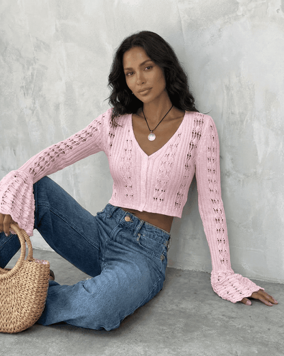 Lauven Blossom Cardigan in pink, a cropped cotton knit with flare sleeves and V-neckline, styled with denim.