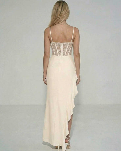 Back view of Lauven Blush Maxi Dress showcasing sheer lace bodice and ruffled asymmetrical skirt.