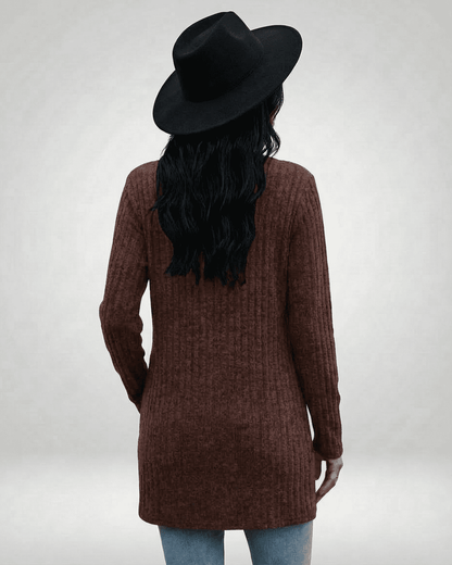 Back view of a model wearing the Lauven Cairo Cardigan in brown, featuring a longline silhouette and textured knit.