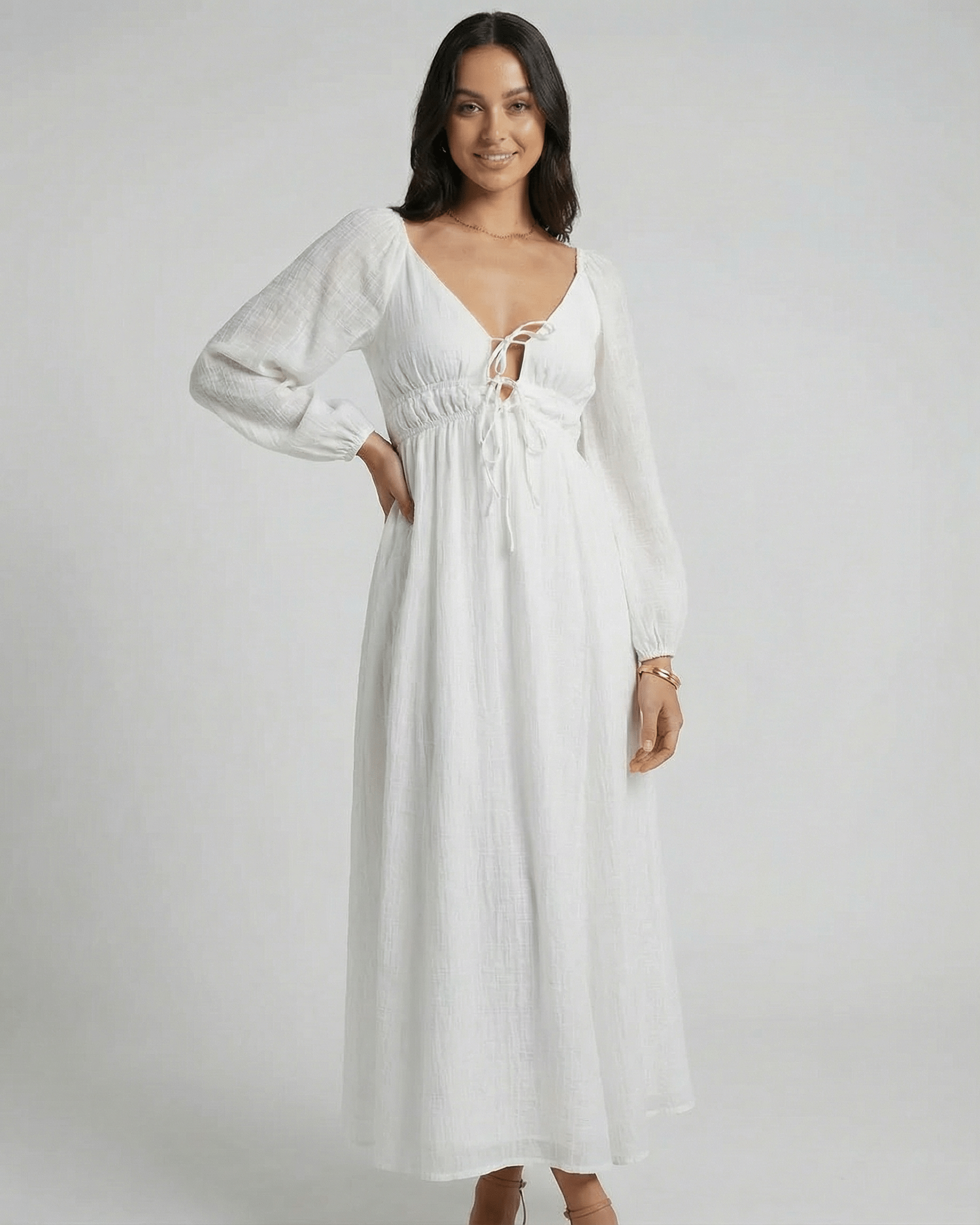 Calista Maxi Dress by Lauven featuring a deep V-neckline and flowing ankle-length design in a solid white color.