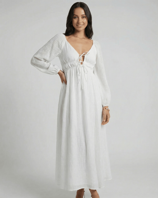 Calista Maxi Dress by Lauven featuring a deep V-neckline and flowing ankle-length design in a solid white color.
