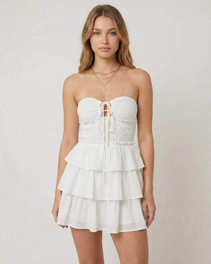 Capri Mini Dress by Lauven, off-shoulder A-line silhouette with layered short skirt in white.