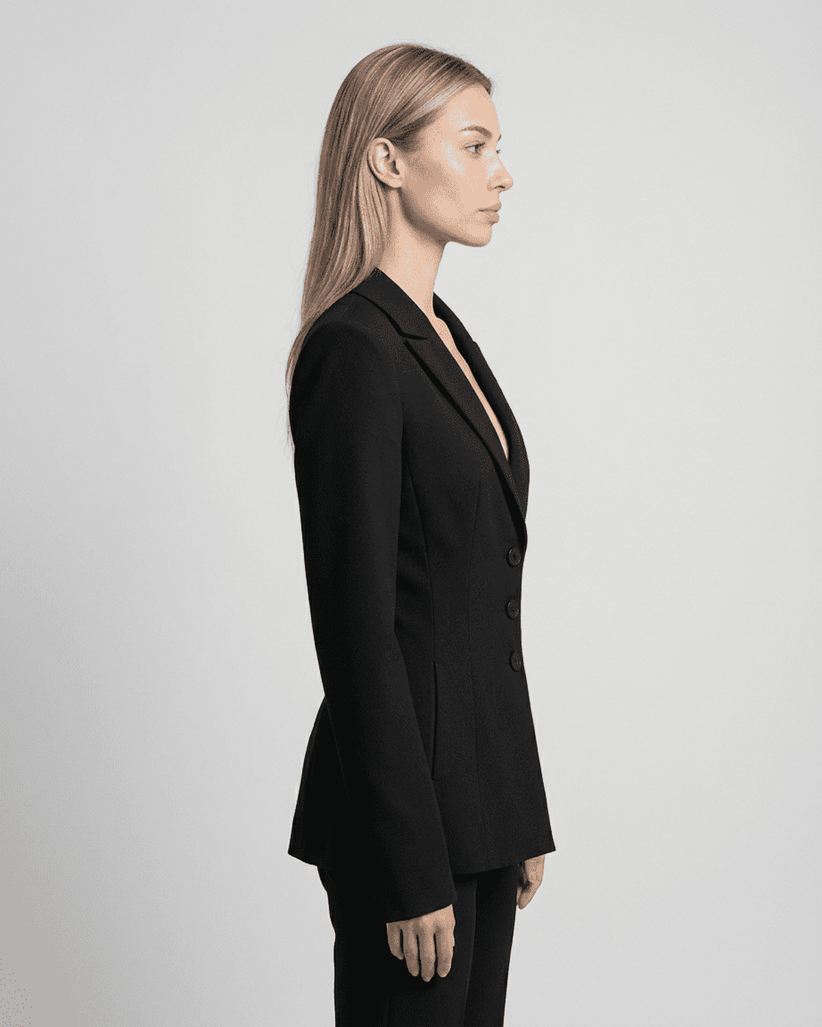 Celeste Blazer by Lauven shown from the side, featuring a fitted waist, V-neckline, and tailored silhouette.