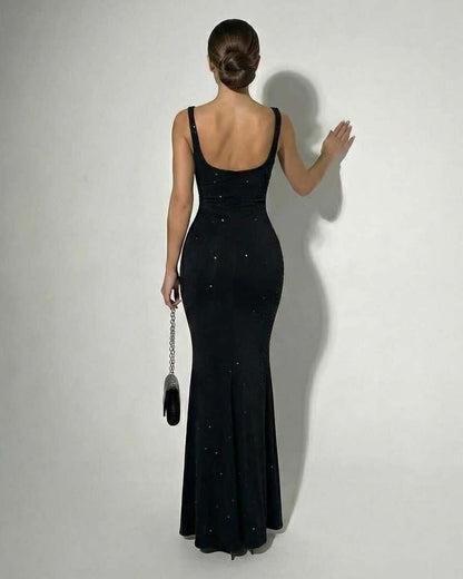 Celeste Maxi Dress by Lauven, showcasing a sleek black satin finish with subtle sparkle and modern silhouette.