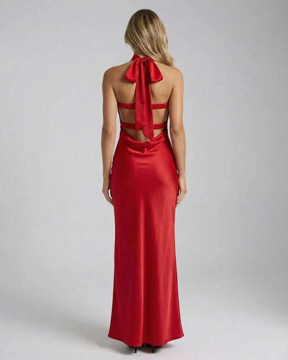 Celeste Maxi Dress by Lauven featuring a stunning red satin back with a bow detail and trendy cut-out design.