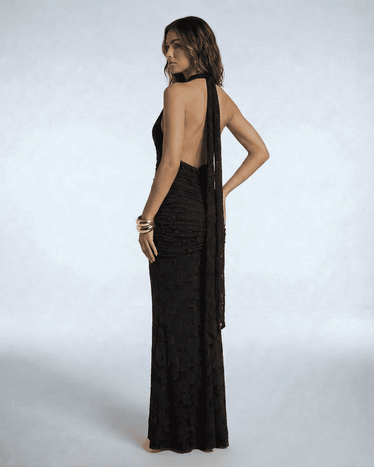 Celeste Maxi Dress by Lauven showcasing an elegant back design and ruched bodycon silhouette in black.